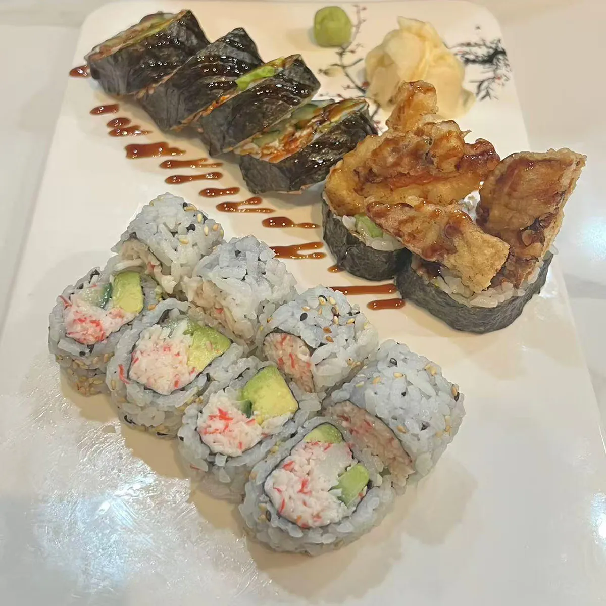Assorted sushi rolls with wasabi and ginger on plate at Wagaya Sushi Grill, a Japanese Restaurant in Tigard